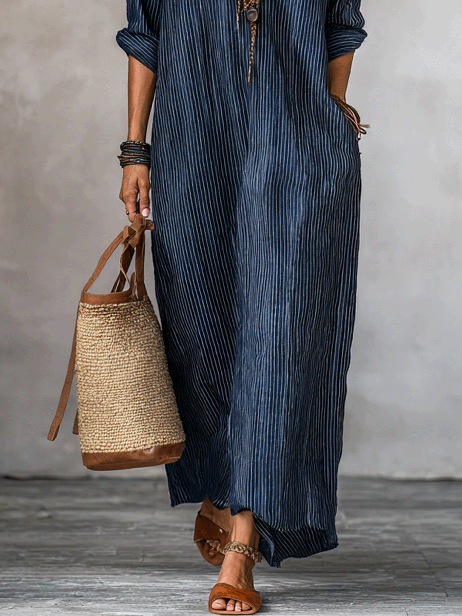 Blue indigo maxi dress lower half with vertical stripes and long flowing hem