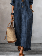 Blue indigo maxi dress lower half with vertical stripes and long flowing hem