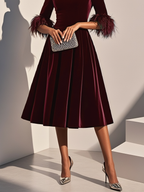 Burgundy velvet midi A-line dress with round neck and feather-trimmed sleeves