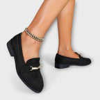 Black loafers with gold buckle strap detail and slim block heel, front view