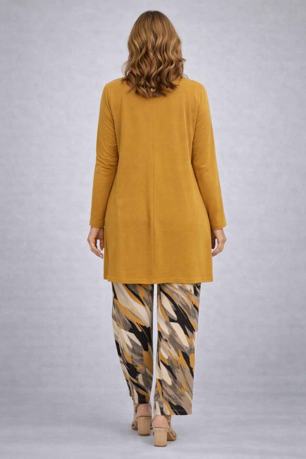 Mustard tunic with patterned wide-leg pants, back view