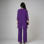 Purple three-piece set back view with draped tunic overlay and wide-leg trousers