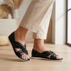 Knot-strap slide sandals, black, open-toe, side view with white sole