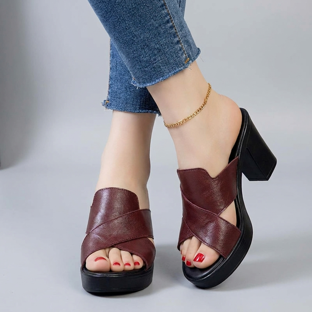 Burgundy orthopedic sandals with crisscross straps and black platform block heel.