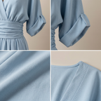 Light blue v-neck high-waist jumpsuit with gathered sleeve cuffs and elastic waist
