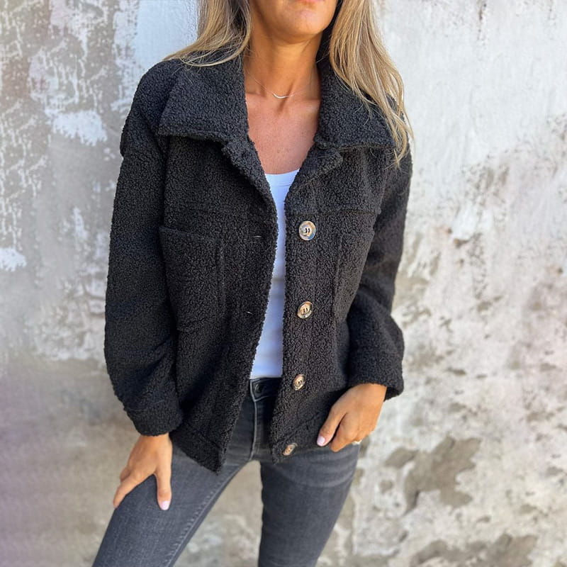Black teddy jacket with button front, point collar, and flap chest pockets
