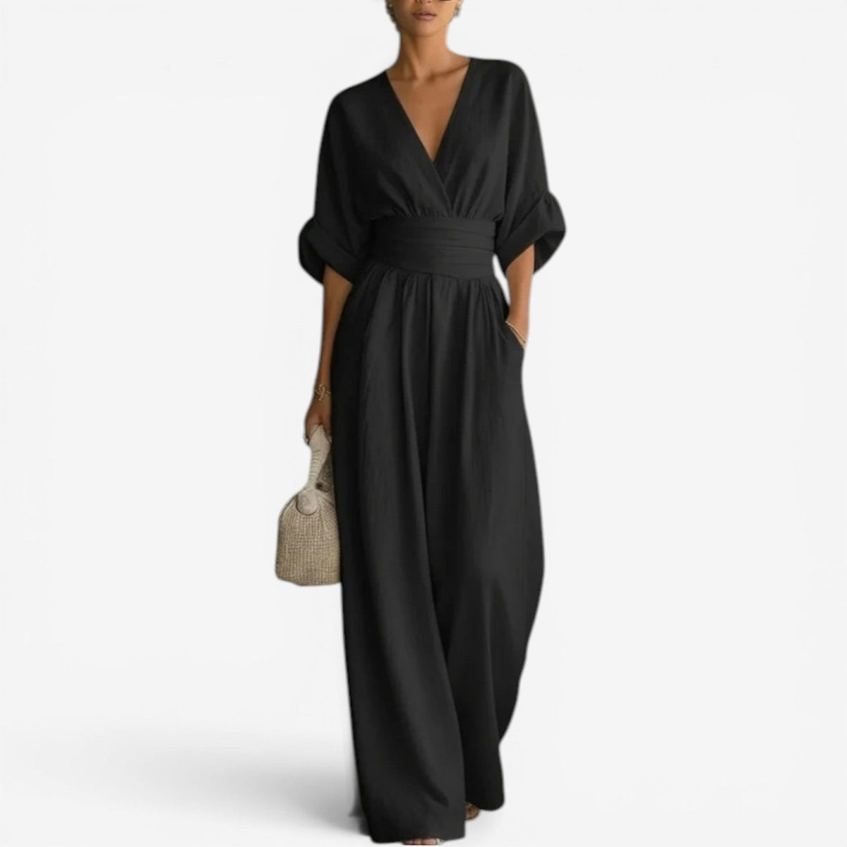 Black wrap V-neck jumpsuit with cinched waist and wide-leg trousers