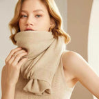 Light beige merino wool shawl with ruffled knit trim at edge