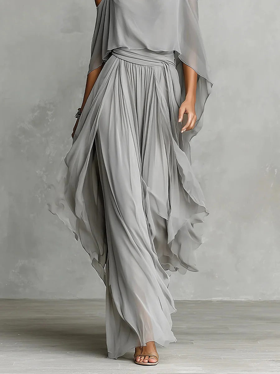 Gray draped off-shoulder top with elastic waist pleated maxi skirt, side view