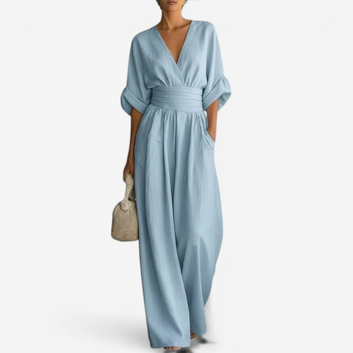 Light blue wrap jumpsuit with gathered elastic waist and wide-leg trousers