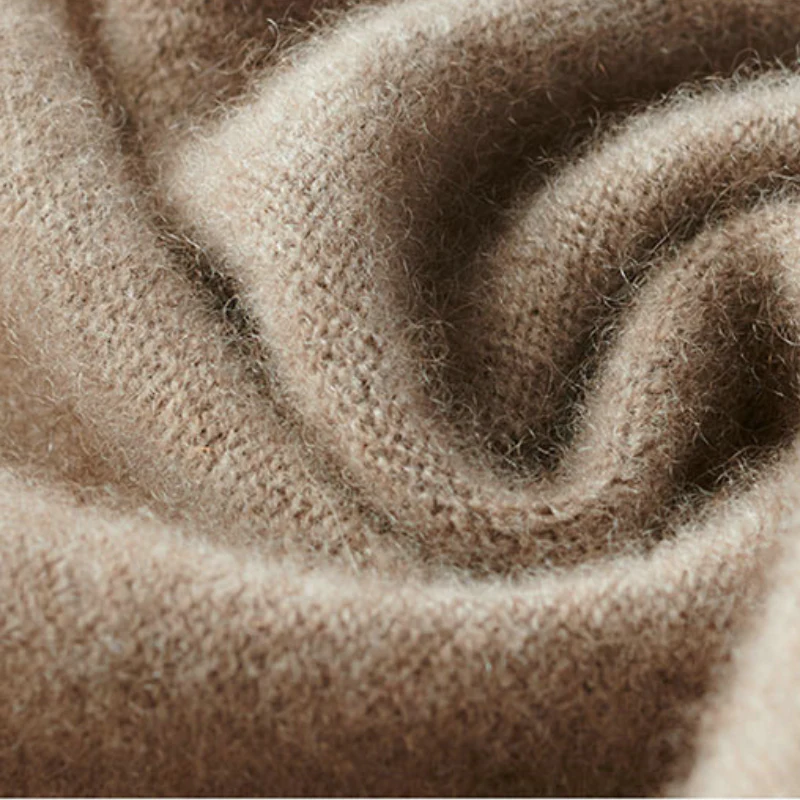 Beige merino wool shawl knit texture close-up