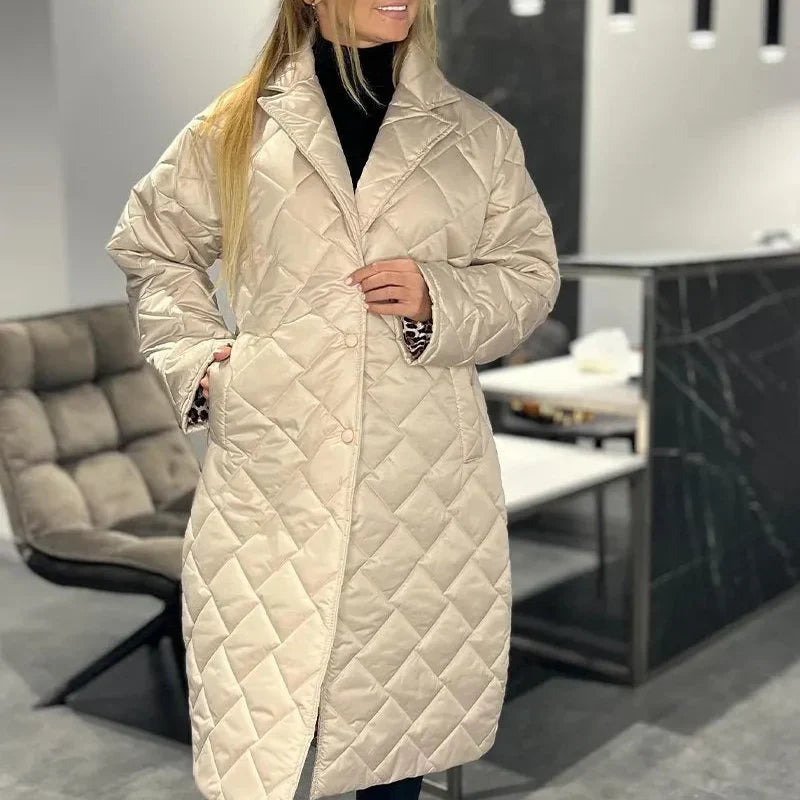 Beige quilted long winter coat with zip front and high collar