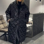 Black longline quilted winter coat with zip front and structured shoulders