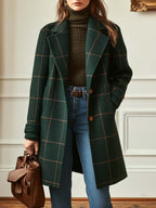 Dark green windowpane plaid tweed coat with long sleeves and button front