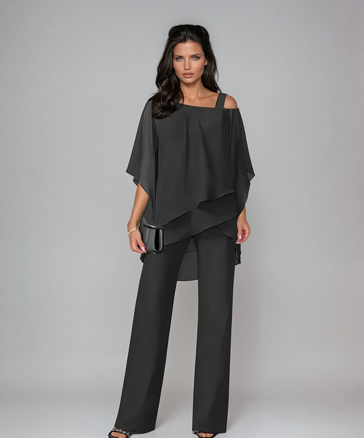 Black layered cold-shoulder blouse with asymmetrical drape and wide-leg pants set