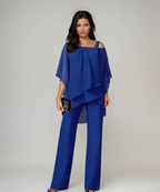 Blue layered cold-shoulder blouse with draped hem and wide-leg pants set