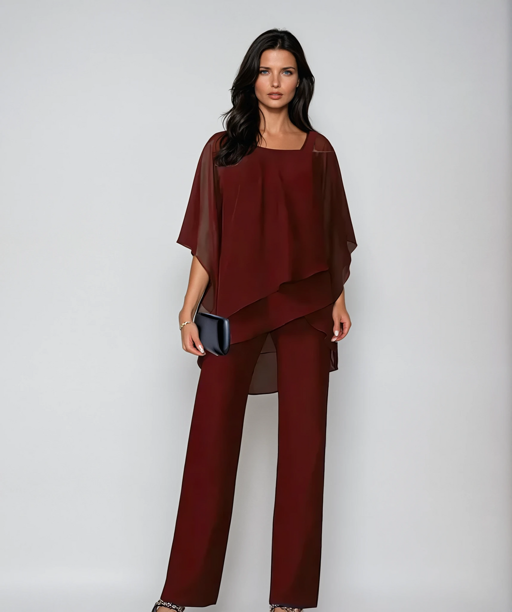 Burgundy layered cold-shoulder blouse with draped hem and wide-leg pants set