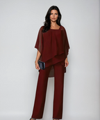 Burgundy layered cold-shoulder blouse with draped hem and wide-leg pants set