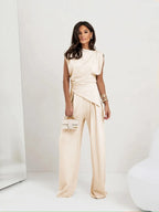 White sleeveless cropped top with tie detail and wide-leg pants two-piece set