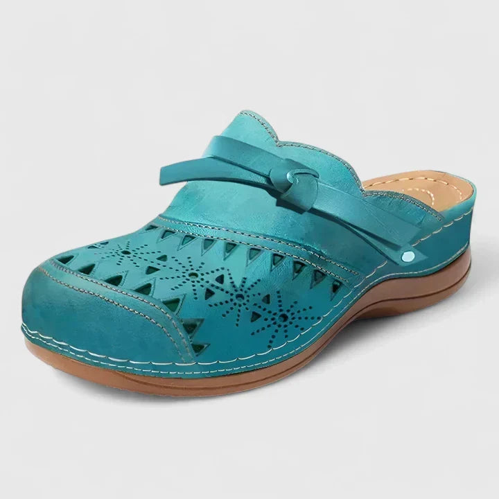Teal perforated mule sandals with wide strap and cushioned outsole