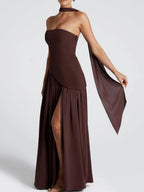 Strapless wine maxi dress with flowing side drape and thigh-high slit