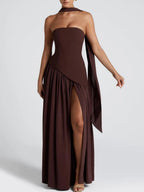 Strapless maxi dress in deep maroon with flowing draped panel and deep side slit