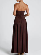 Strapless maxi dress in deep maroon with gathered back and tied ribbon at waist