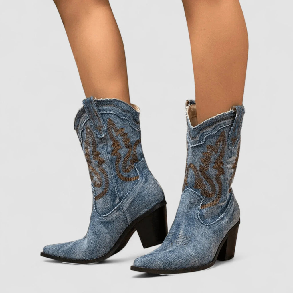 Blue denim ankle boots with brown embroidered pattern and sculpted block heel