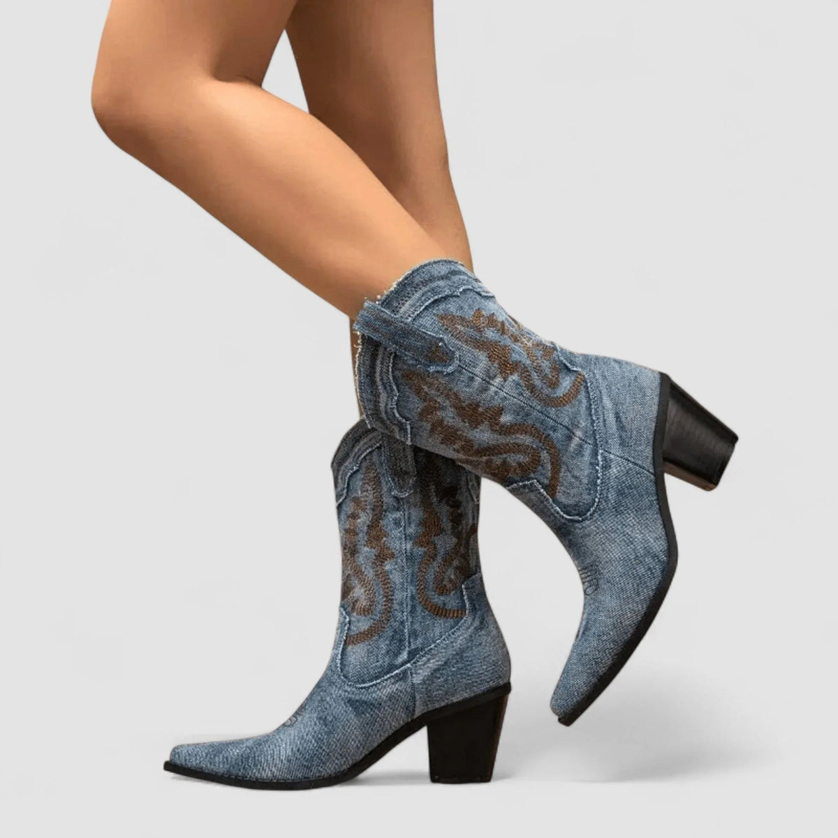 Blue denim ankle boots with brown embroidery and squared heel, side angle