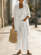 Elegant set with long short-sleeve shirt and wide-leg pants, solid white