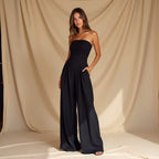 Black strapless wide-leg jumpsuit with empire waist and flowing wide legs