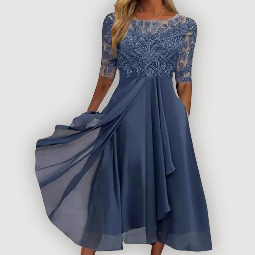 Blue lace bodice dress with 3/4 sleeves and layered chiffon skirt, draped overlay