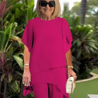 Pink draped short-sleeve top with matching wide-leg pants, two-piece set