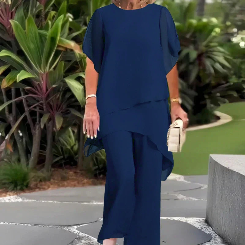 Navy two-piece set with draped short-sleeve top and matching wide-leg pants