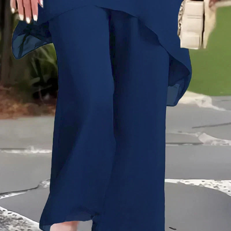 Navy flowy wide-leg pants with draped detail and matching top, two-piece set