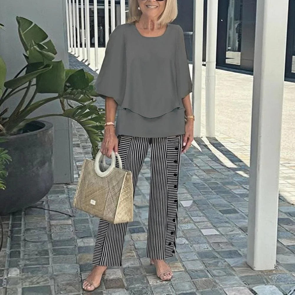 Gray two-piece set: short-sleeve layered top and black-and-white striped pants