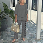 Gray two-piece set: short-sleeve layered top and black-and-white striped pants