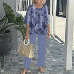 Blue floral two-piece set: short-sleeve layered top and light-blue straight pants