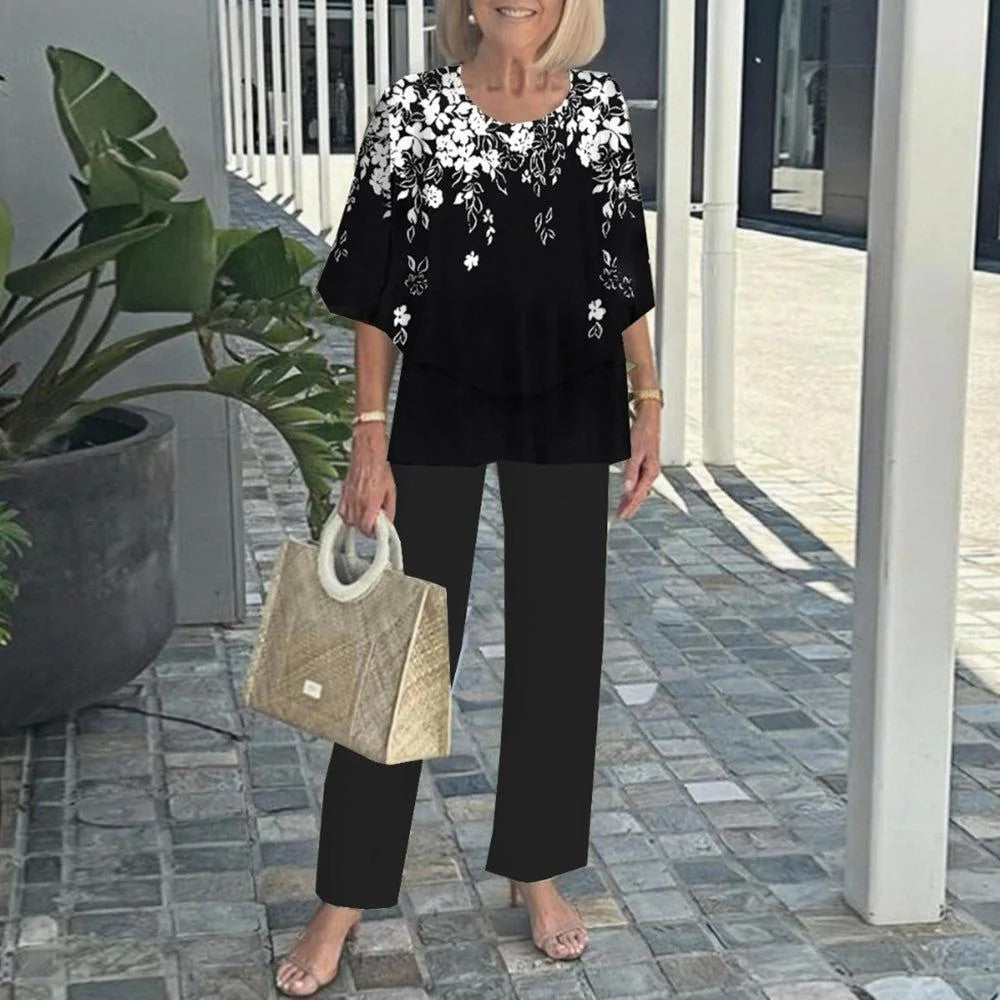 Black two-piece set: floral short-sleeve layered blouse and black straight pants