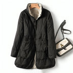 Black quilted winter puffer jacket with hood, front buttons, and gathered waist panels