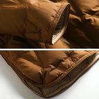 Copper-brown padded puffer jacket cuff and hem with contrast inner lining and stitched edge