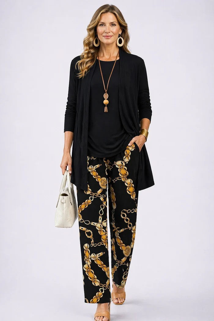 3-piece set in black with longline jacket, solid top, and gold chain-print pants.