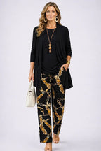 3-piece set in black with longline jacket, solid top, and gold chain-print pants.