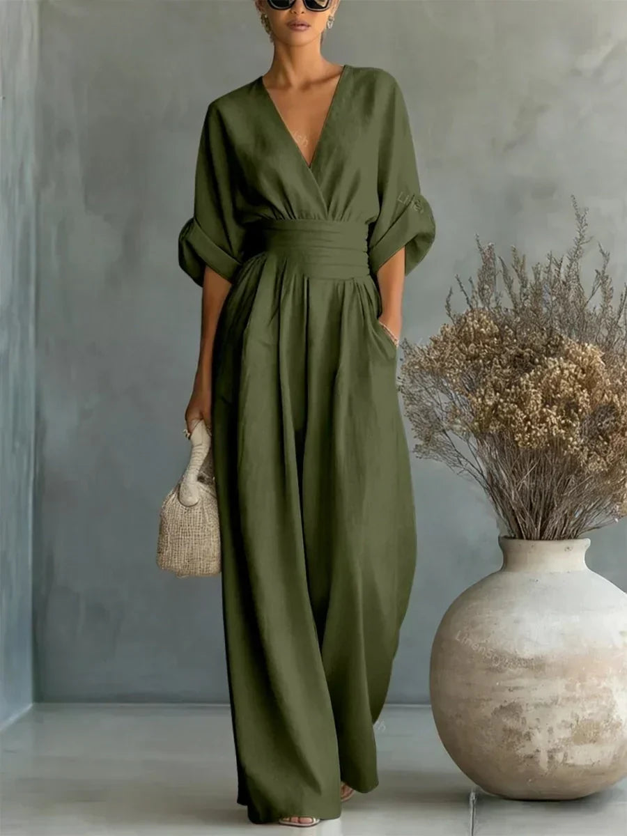 Olive green V-neck high-waist jumpsuit with cinched waist and wide-leg flow, dolman sleeves