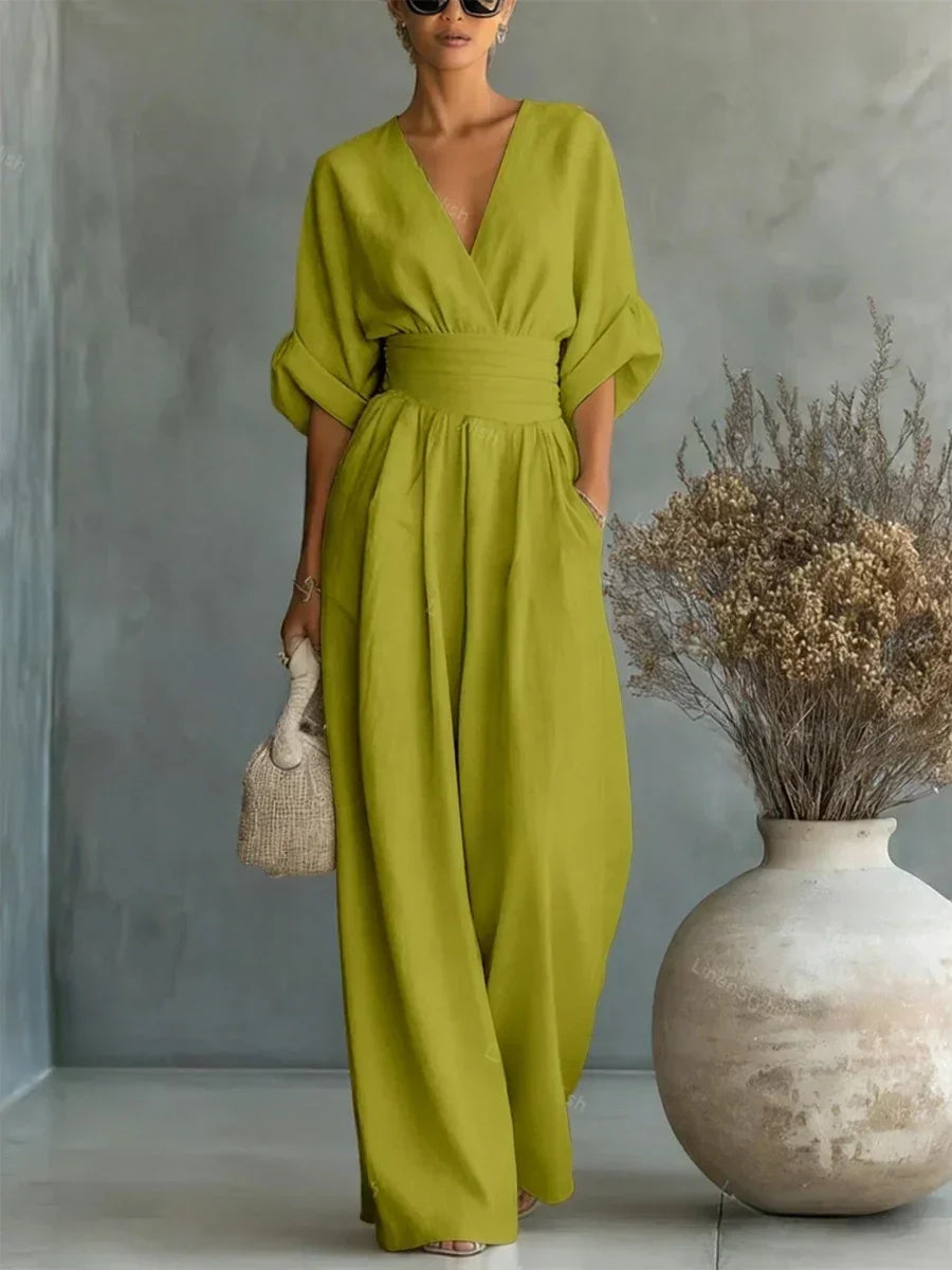 Lime green V-neck high-waist jumpsuit with cinched waist and wide-leg flow, dolman sleeves