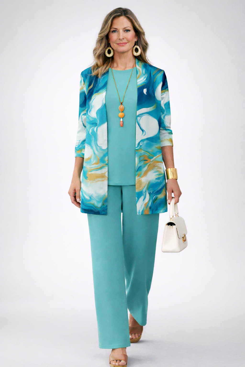 Front view of blue patterned jacket with teal top and wide-leg trousers in 3-piece set